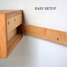 a close up of a wooden shelf on the wall