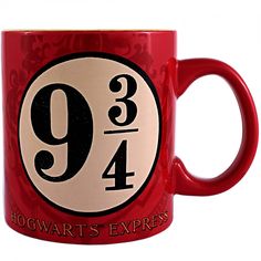 a red harry potter mug with the number nine on it's side and hogwarts express logo