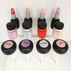 nine mac cosmetics bottles lined up on top of each other