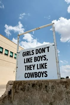 a sign that says girls don't like boys, they like cowboys