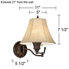 a wall light with a white shade on it's side and measurements for the lamp