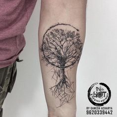 a man with a tree tattoo on his arm