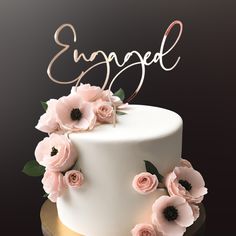 Engaged Cake Topper in rose Gold mirror acyrlic for engagement party on a white cake with pink anemone flowers Engagement Cake Designs Simple, Simple Engagement Cake, Engagement Cake Designs Unique, Engagement Cake Toppers Unique, Engagement Cake Designs, Engagement Topper, Engagement Cake Images, Just Engaged Cake Topper