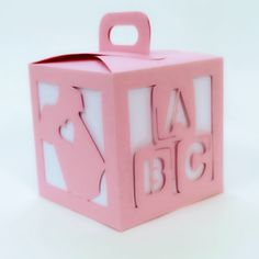 a pink box with the word la big cut out of it's sides and handles