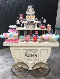 a candy cart with lots of candies and sweets on it's wheels for sale