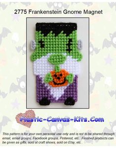 an image of a cross stitch pattern for a cell phone case with a green monster holding a pumpkin