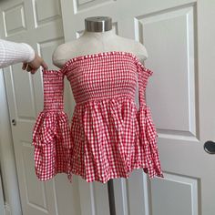 Smock Baby Doll Top With Off The Shoulder Sleeves New With Tags Spring Gingham Smock Top, Cute Red Tops For Vacation, Red Sleeveless Top For Picnic, Summer Smock Gingham Tops, Summer Gingham Smock Top, Cute Beach Top With Smocked Back, Sleeveless Tops With Smocked Bodice For Picnic, Cute Beach Tops With Smocked Back, White Ruffled Top For Picnic