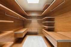 an empty wooden walk in closet with shelves and drawers stock photo - 959782