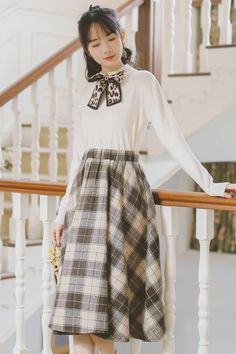 The vintage plaid circle skirt you've been looking for. Features a rustic plaid pattern in a thick tweed fabric, elastic waistband and modest midi length. Lined. S: 25"-35" waist, 27" lengthM: 26"-36" waist, 27" lengthL: 27"-37" waist, 27.5" lengthXL: 28"-38" waist, 27.5" length Casual Tweed Skirt For Fall, Fall Beige Tweed Skirt, Casual Tweed Skirt For Winter, Fall Plaid Relaxed Fit Skirt, Relaxed Plaid Skirt For Fall, Plaid Relaxed Fit Skirt For Fall, Plaid Houndstooth Skirt For Fall, Plaid Long Skirt For Fall, Long Plaid Skirt For Fall