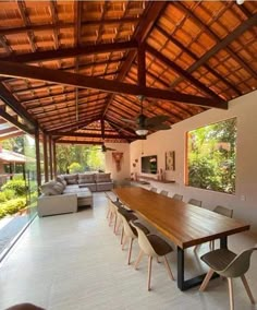 a large wooden table sitting in the middle of a living room