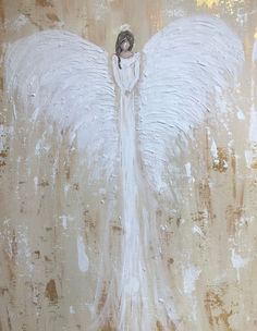 an angel painting with white wings on a brown background and gold paint splatters