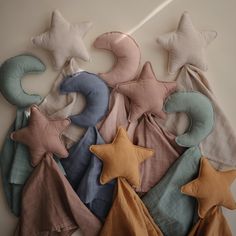 several star shaped pillows are arranged on the wall