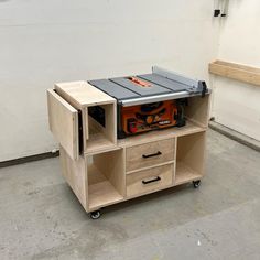 a workbench with a table sawing on the top and drawers below it