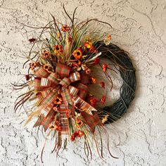 a wreath hanging on the side of a wall