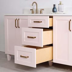 a bathroom vanity with two drawers and a faucet on the sink counter top