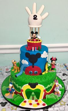 a mickey mouse birthday cake on a table