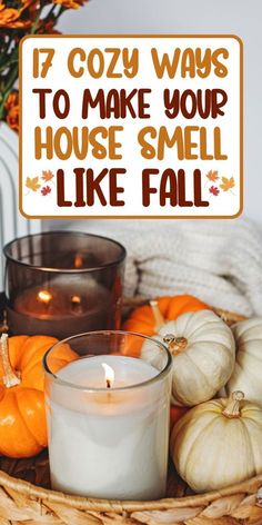 a basket filled with pumpkins and candles next to a sign that says 17 cozy ways to make your house smell like fall