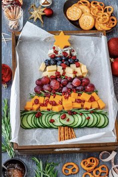 a christmas tree made out of fruit and crackers