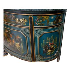 an ornate painted sideboard with flowers and animals