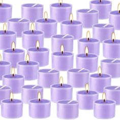 many purple candles are arranged in rows on a white background, with one candle lit and the other turned upside down