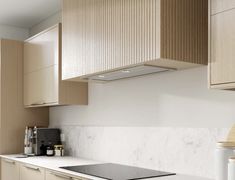 a stove top oven sitting inside of a kitchen next to wooden cupboards and counter tops