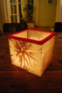 a candle holder sitting on top of a wooden table