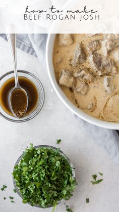 a bowl of soup next to a small bowl of chopped parsley on a white surface