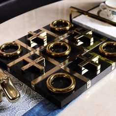 a black and gold stove top sitting on top of a table