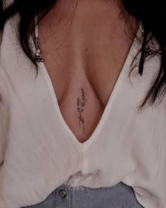 a woman with a tattoo on her chest