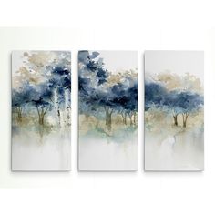 three paintings on the wall with trees painted in blue and white colors, each one being an abstract painting