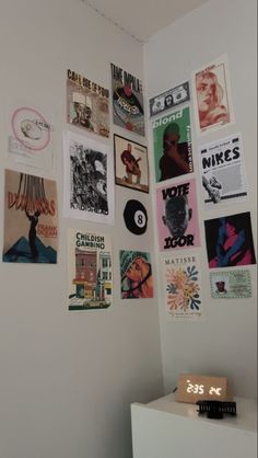 there are many different posters on the wall