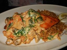 a white plate topped with pasta and veggies