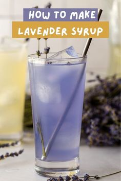 lavender syrup in a tall glass with a straw sticking out of it