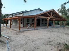 a house with a covered porch and picnic table