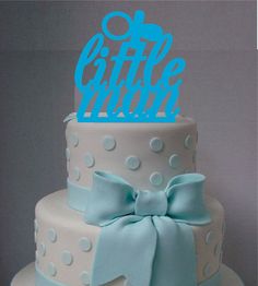 a white and blue cake with polka dots on it