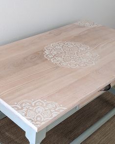 a wooden table with white paint on it