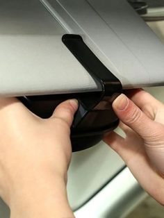 a person is using a mouse on a laptop