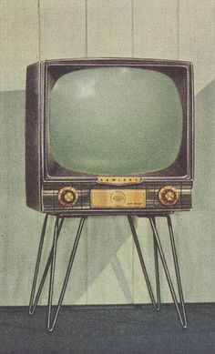 an old tv sitting on top of a metal stand