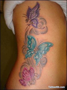 the back of a woman's stomach with butterflies on it