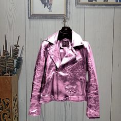 Shop This Metallic Pink Leather Jacket - Shiny Moto Biker Jacket for Women & Men - Genuine Leather, 7 Colors Looking for a stylish and trendy jacket that can make you stand out? Look no further than our Metallic Pink Leather Jacket! Crafted from genuine leather, this Pink jacket features a shiny metallic coat that is sure to turn heads.The moto style, lapel collar, and belted waist give it a bold and fashionable look that is perfect for both men and women. Please review all product details, incl Pink Motorcycle Jacket, Pink Punk Biker Jacket For Winter, Pink Punk Biker Jacket With Long Sleeves, Pink Fitted Punk Biker Jacket, Trendy Winter Outerwear For Motorcycling, Trendy Winter Biker Jacket For Motorcycling, Pink Winter Biker Jacket, Winter Pink Biker Jacket, Pink Biker Jacket For Fall Streetwear