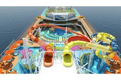 an aerial view of the top deck of a cruise ship, with water slides and waterslides