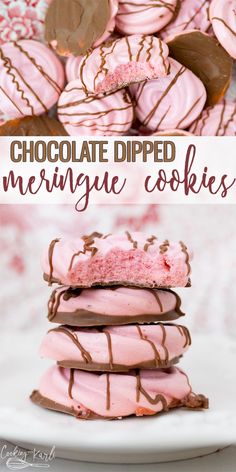 chocolate dipped meringue cookies stacked on top of each other with pink frosting