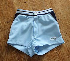 Vintage 80's, very nice sporty shorts, light blue polyester jersey fabric with navy details, elasticated waist, made in Italy.  Size 4/6/8/12 years  Vintage condition level 5, new old stock ( washed once ) We assess the condition of our vintage items on a scale from 0 to 5. Level 5 corresponds to an almost new vintage condition. Any defects are systematically reported. Even though in very good condition, vintage items may present imperfections due to their age, which mainly adds to their charm. Sporty Swim Trunks With Built-in Shorts For Play, Blue Sporty Swim Trunks For Playwear, Sporty Fitted Shorts For School, Sporty Stretch Shorts For Playwear, School Stretch Shorts, Sporty School Shorts, Sporty Short Swim Trunks For Playwear, Blue Swim Trunks For Spring Playwear, Sporty Swim Trunks For Playwear