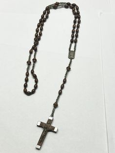 Vintage wood beaded rosary necklace. Vintage silver cross Crucifix reading Inri on front and back of wooden silver cross reads Lourdes Pat pend. Wooden beads. 9461.  JH38H. Beaded Rosary, Rosary Necklace, Necklace Vintage, Silver Cross, Vintage Wood, Wooden Beads, Wood Beads, Rosary, Vintage Silver