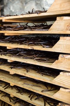 several wooden boards stacked on top of each other with nails sticking out of the sides