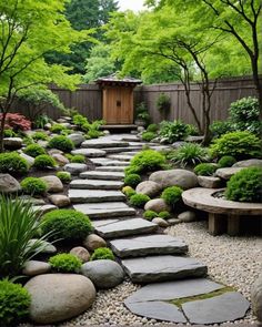 a stone path in the middle of a garden