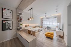 a living room filled with furniture and a flat screen tv