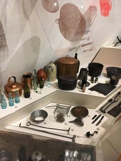 an assortment of pots and pans are on display