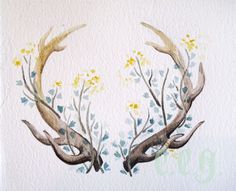 two deer antlers with flowers painted on them