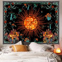 a large tapestry hanging on the wall above a bed